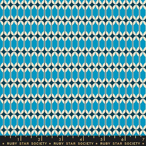 Patterned fabric swatch with blue and white geometric design on a navy background, Ruby Star Society label at the bottom.