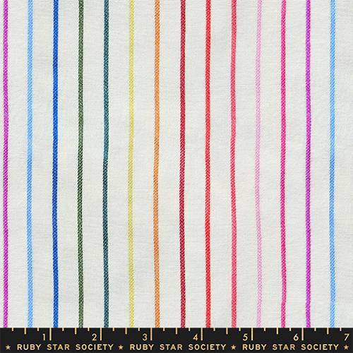 Fabric with multicolored vertical stripes on a white background, featuring the Ruby Star Society label.