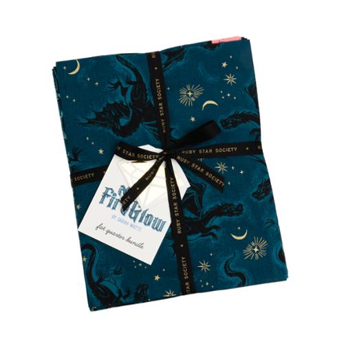 Folded fabric with star and moon pattern and 'Ruby Star Society' branding, tied with a ribbon.