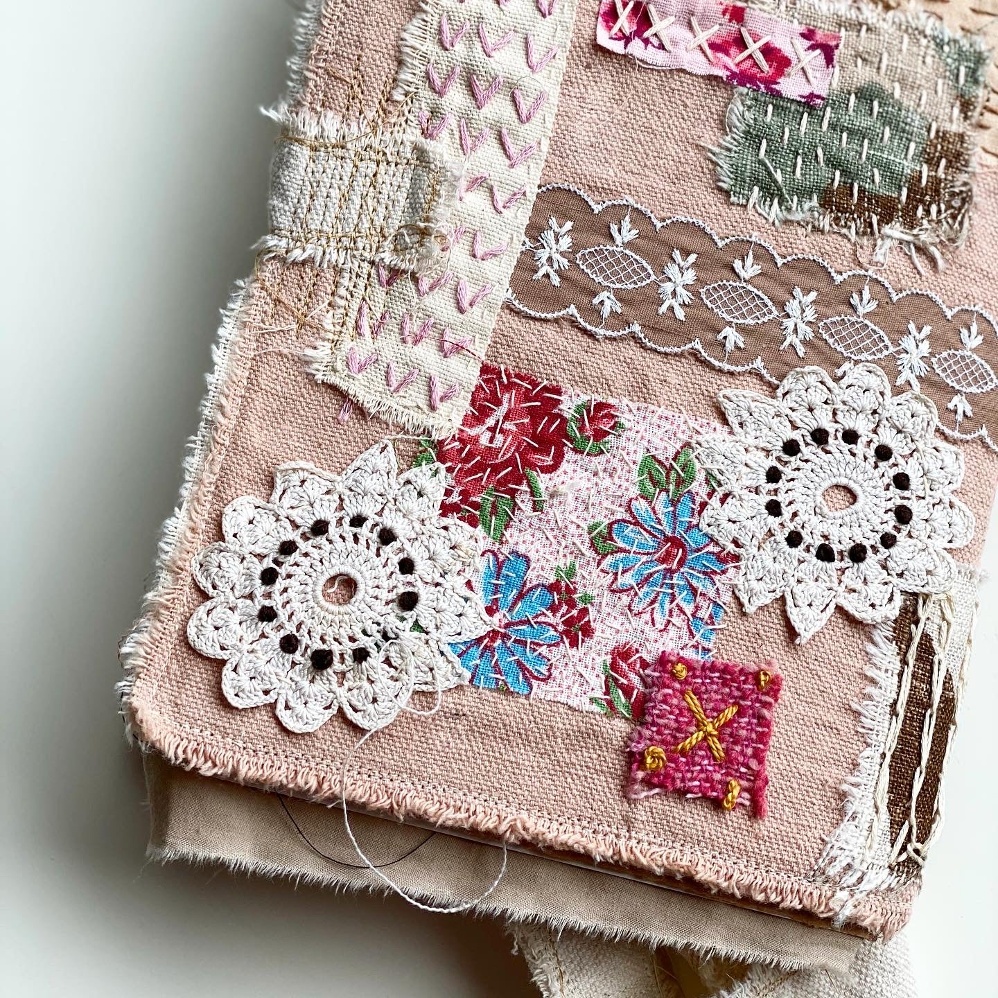 hand stitched vintage doilies on linen covered journal