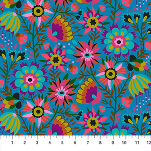 Colorful floral pattern on a blue background with a ruler at the bottom.