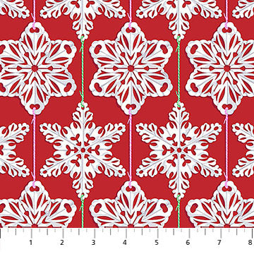 White snowflakes on a red background with green ribbons.