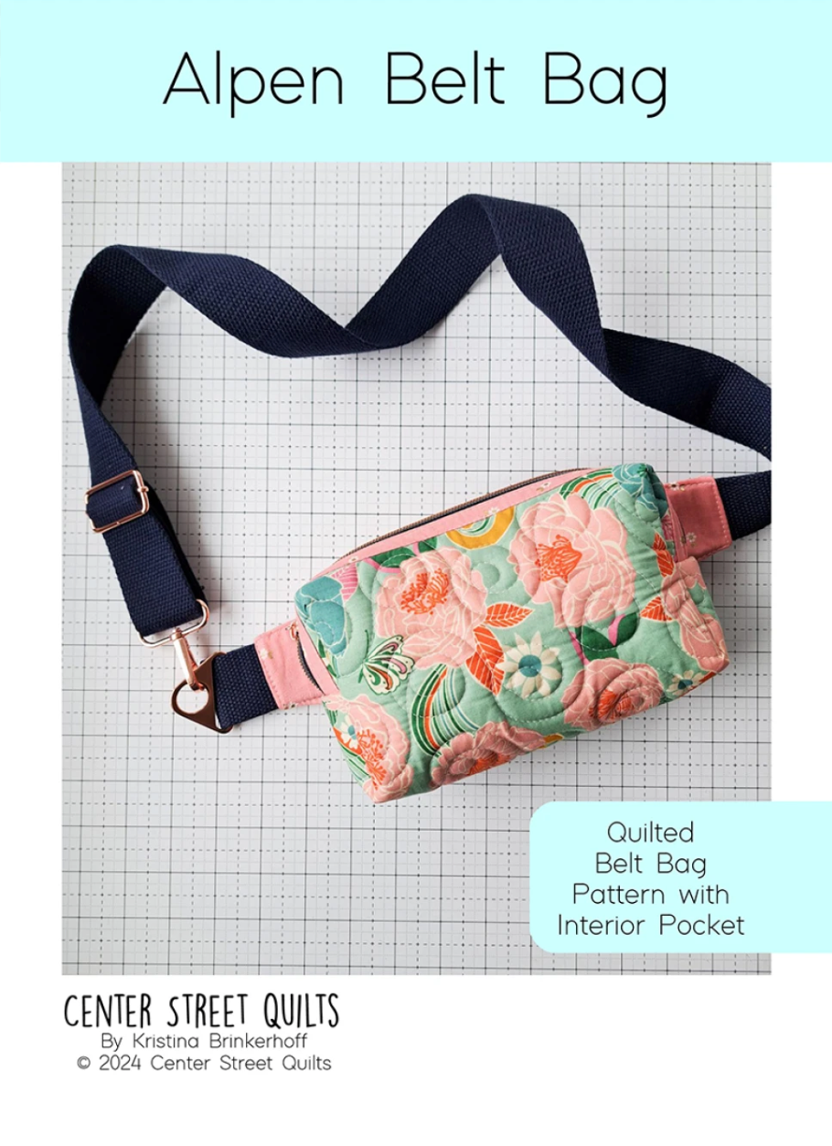 Quilted belt bag with floral design on a grid background, featuring the brand 'Center Street Quilts'.