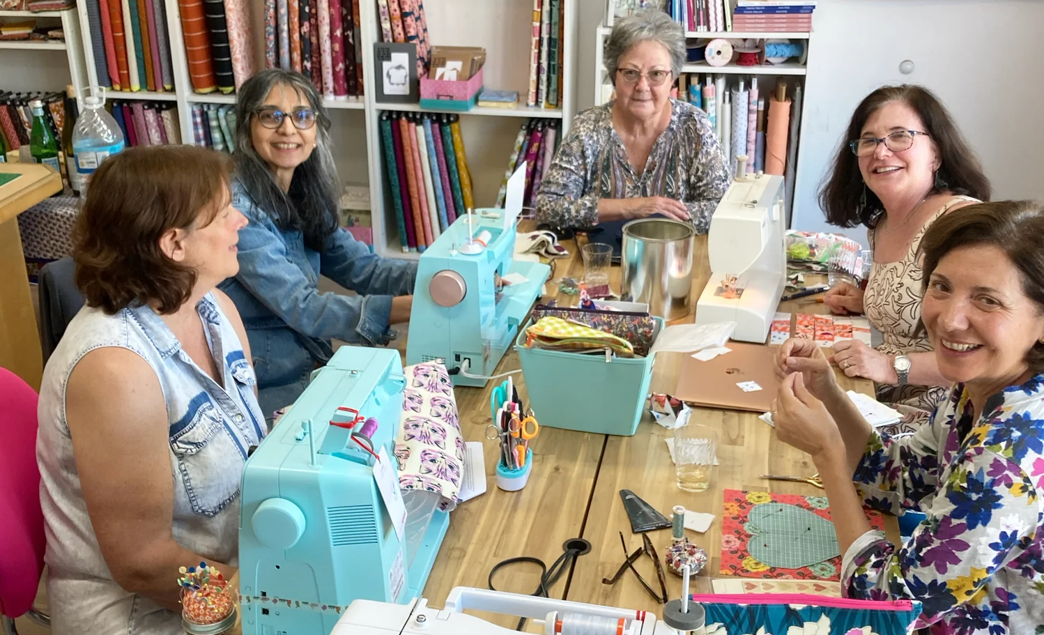 A group of women enjoying a sewing class