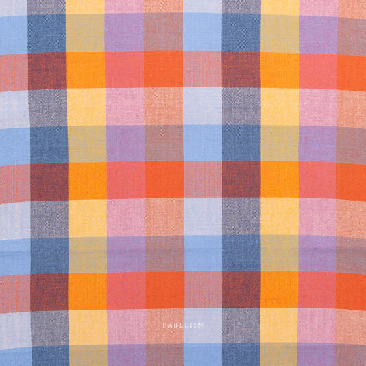 Multicolored checkered fabric pattern with visible brand name 'Fabletics'.