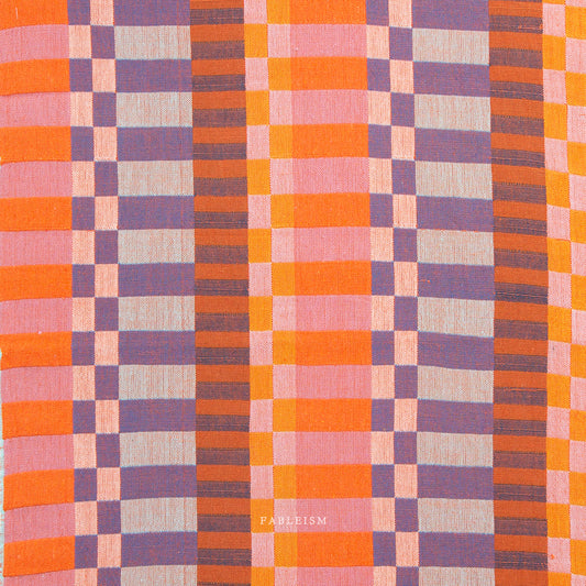 Plaid pattern fabric swatch in orange, purple, and pink.