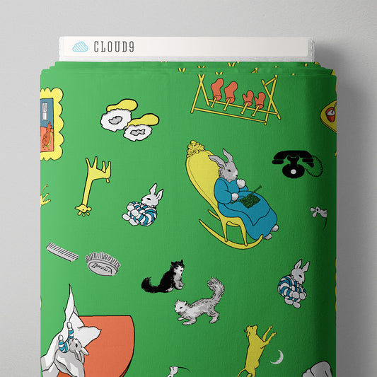 Green fabric on the bolt with characters from Good Night moon. 