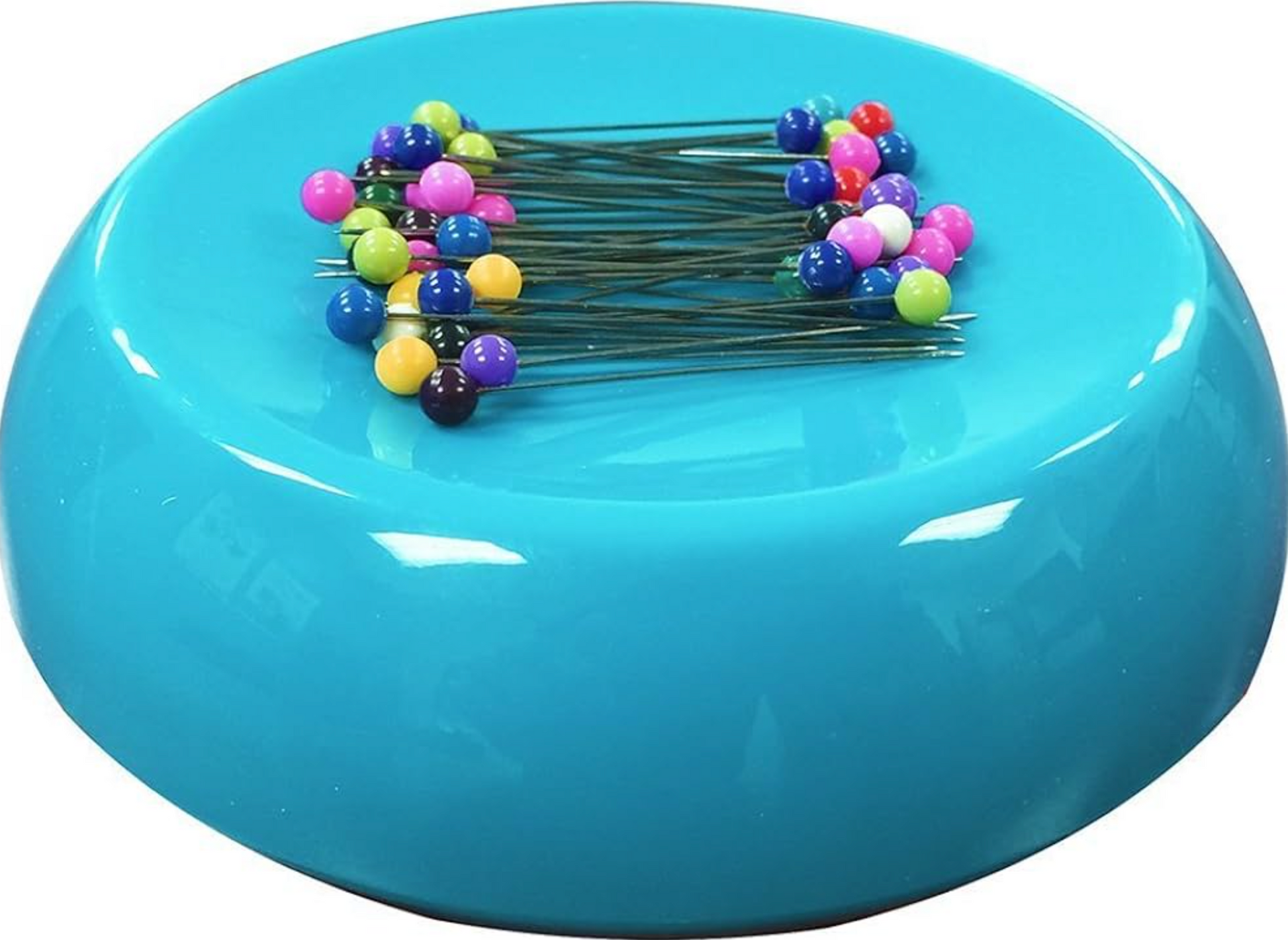 Blue magnetic pincushion with colorful pins on a white background