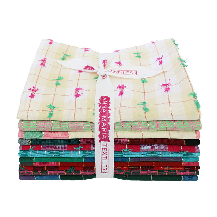 Stack of colorful fabric swatches from 'Anna Maria Textiles' Silver Lining Collection