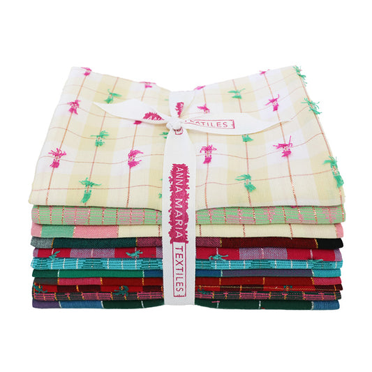 Stack of colorful fabric swatches from 'Anna Maria Textiles' Silver Lining Collection