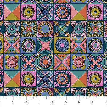 Colorful geometric patterned fabric with a ruler at the bottom