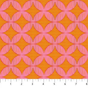 Pink geometric pattern on orange fabric with a ruler at the bottom