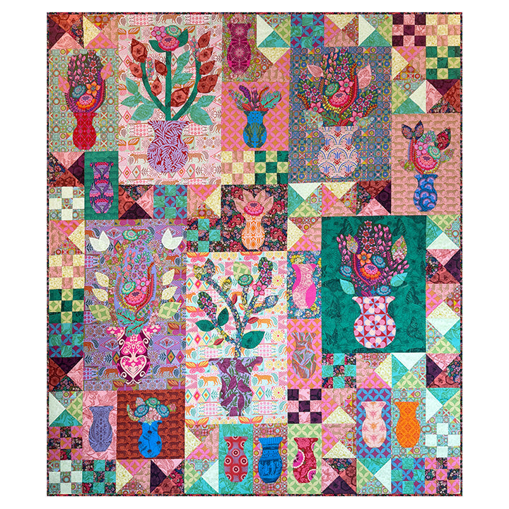 Colorful patchwork quilt with floral and abstract patterns on a white background