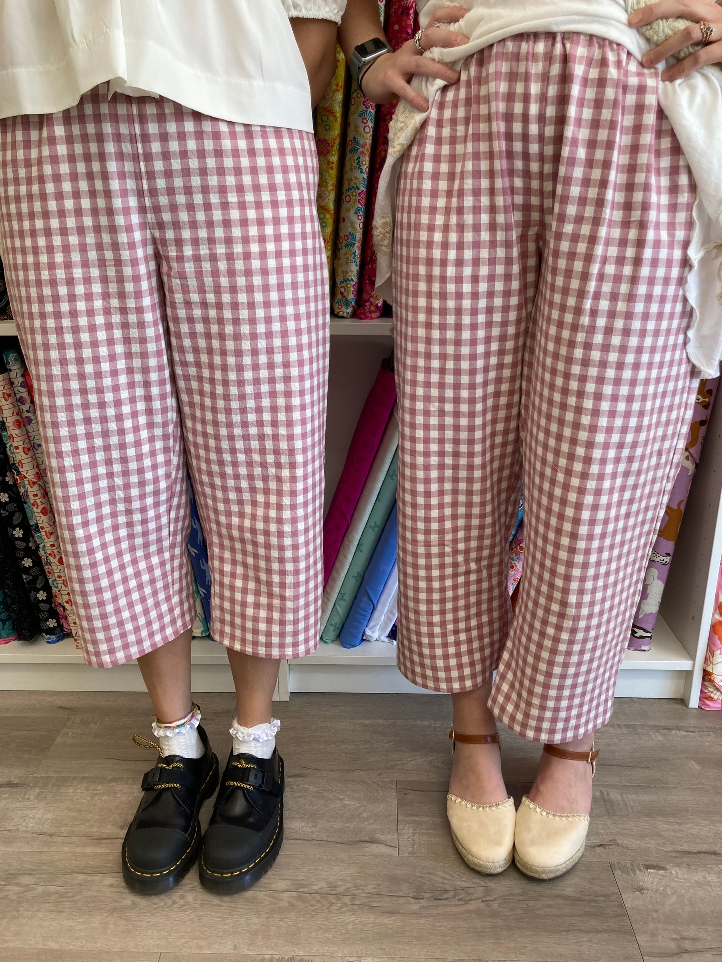 2 people wearing the same pair of gingham pants with different shoes