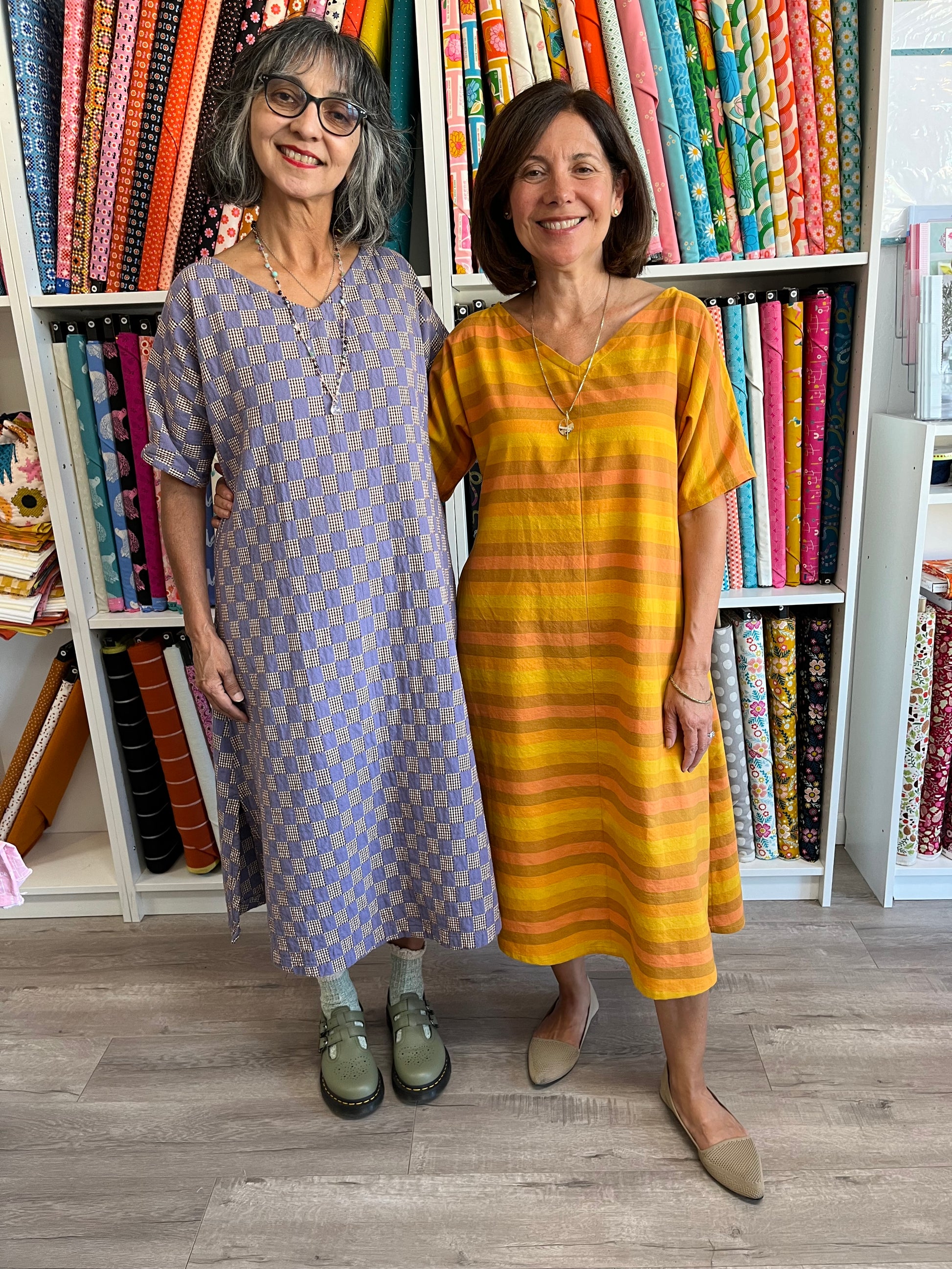 Lana and Angela wear colorful patterned dresses