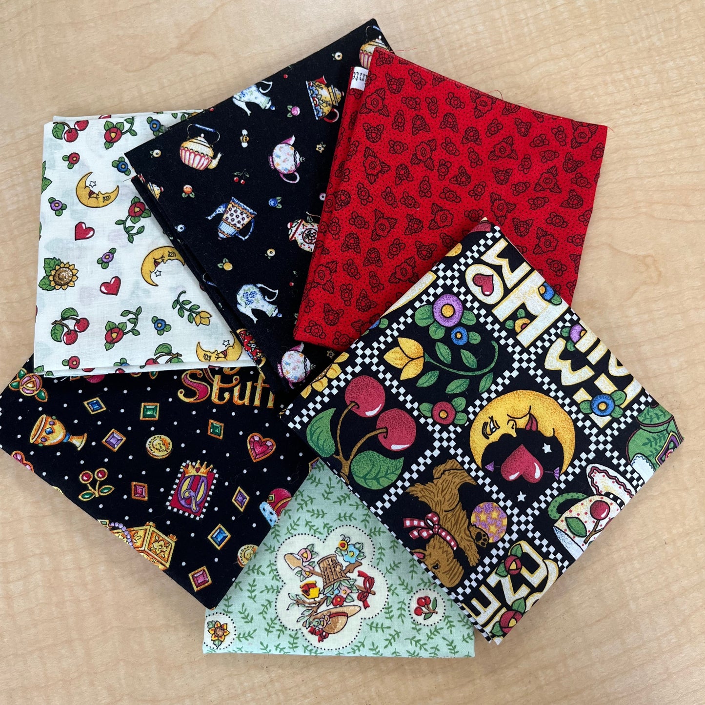 Version 2: a display of 6 fat quarters in V2 Mary Engelbreit pack