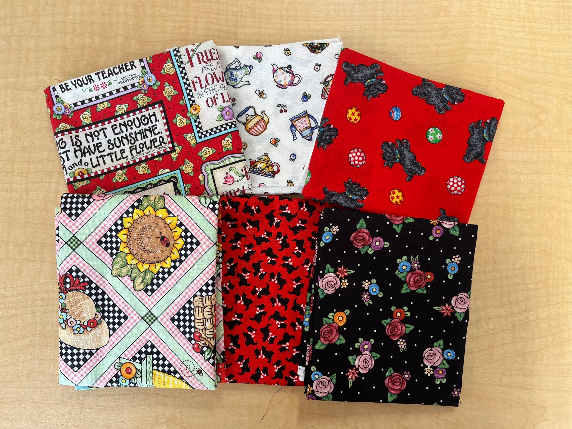 Version 3: a display of 6 fat quarters in V3 Mary Engelbreit pack