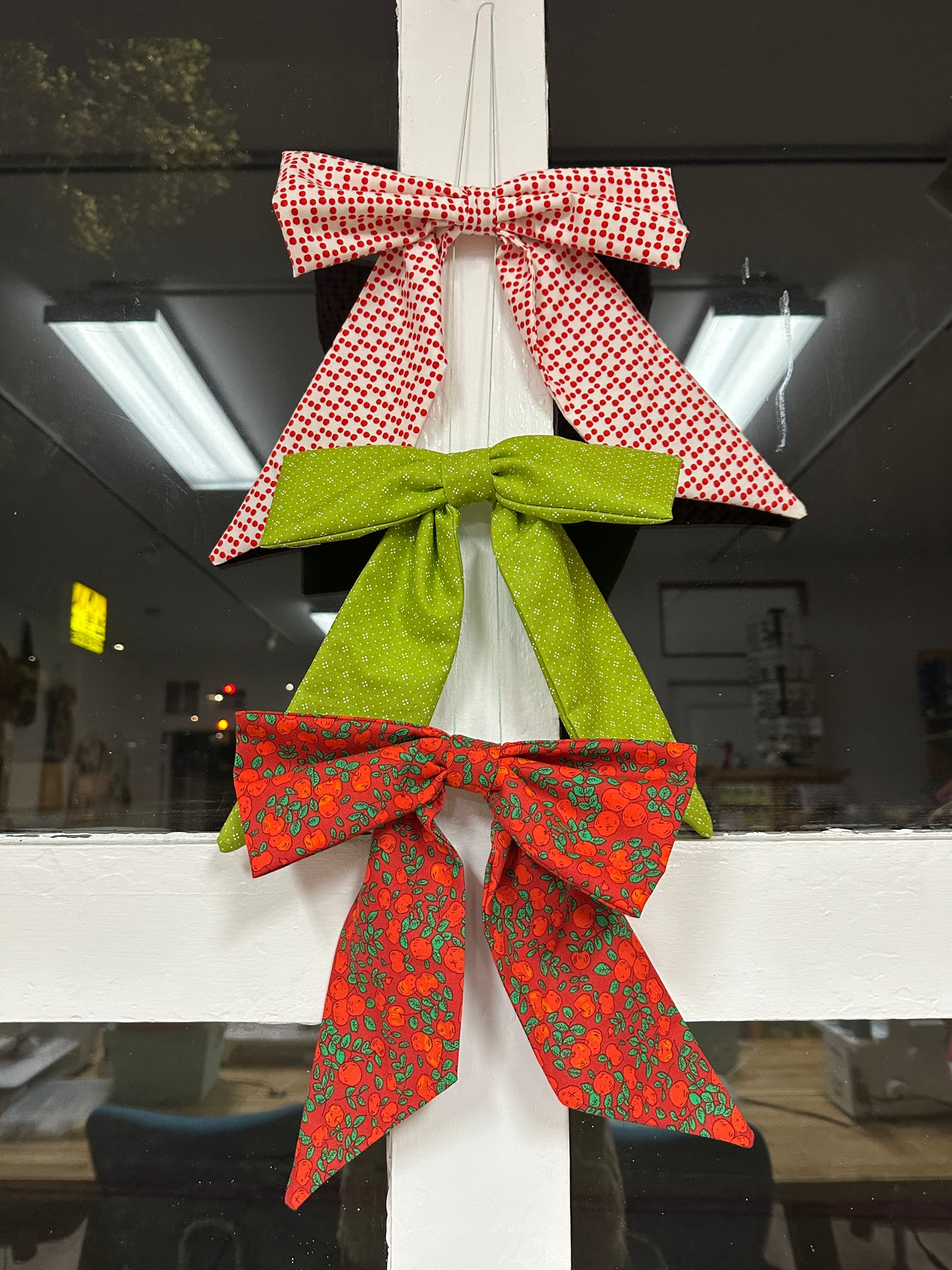 Decorative bows on a window at night