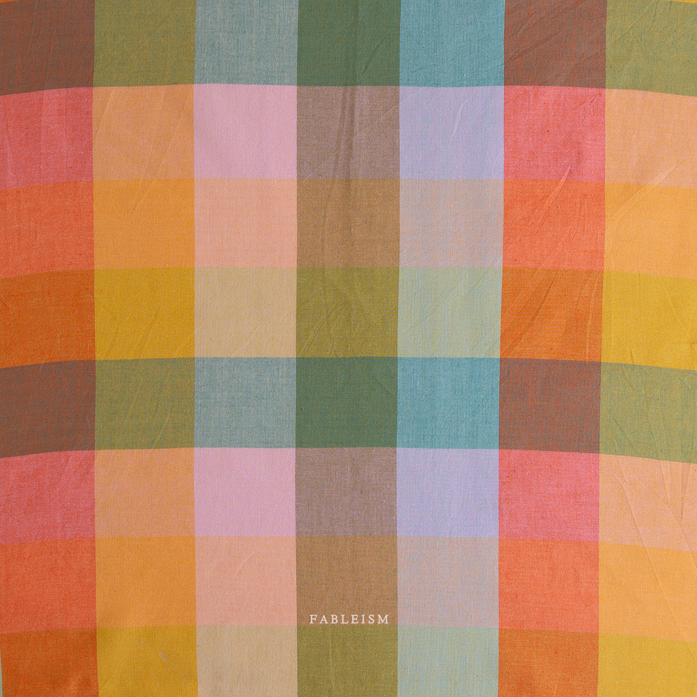Multicolored checkered fabric with 'Fableism' branding