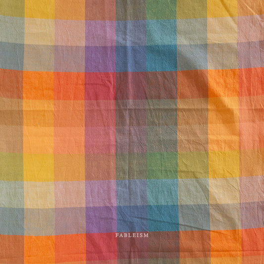 Multicolored checkered fabric with 'Fableism' branding.
