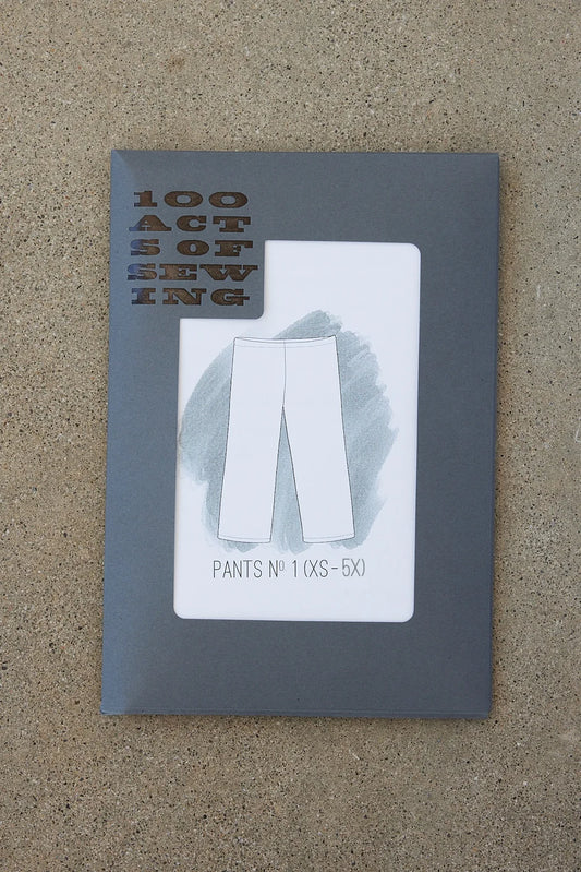 Packaging of printed sewing pattern featuring a drawing of a pair of pants 