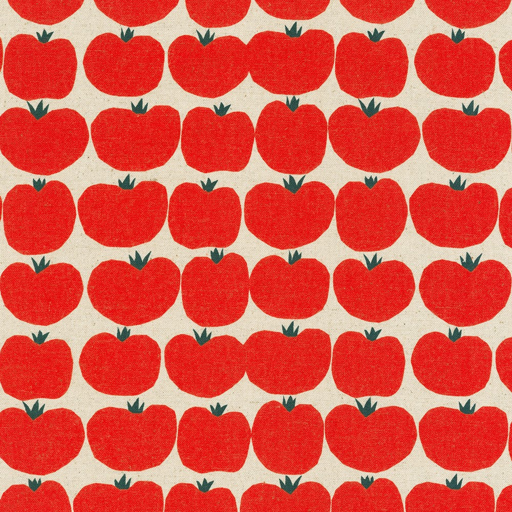 Red tomato on canvas