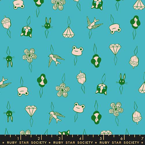 Patterned fabric with cartoon-like illustrations on a blue background, featuring Ruby Star Society branding.