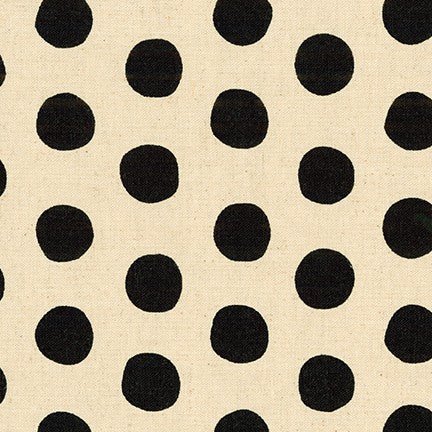 black polka dots on ivory fabric
