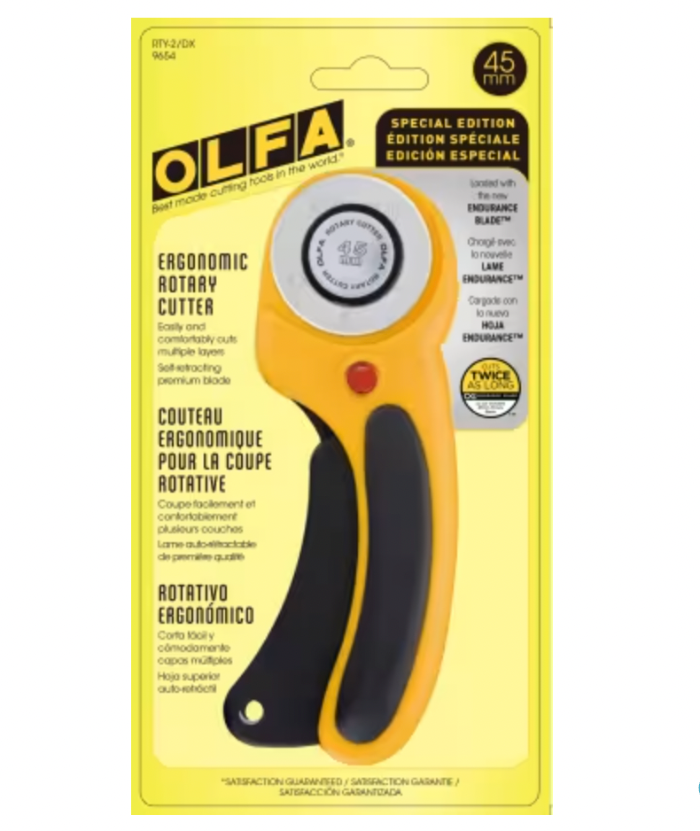 OLFA rotary cutter on a yellow packaging background