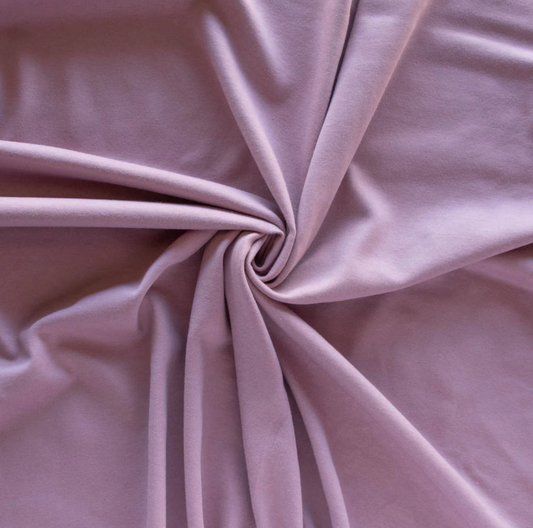 Close-up of pink fabric with a swirl pattern