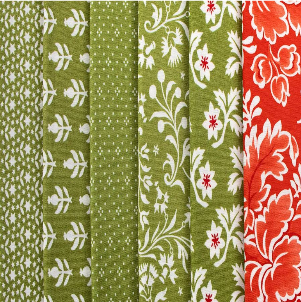 Collection of green and red floral patterned fabrics.