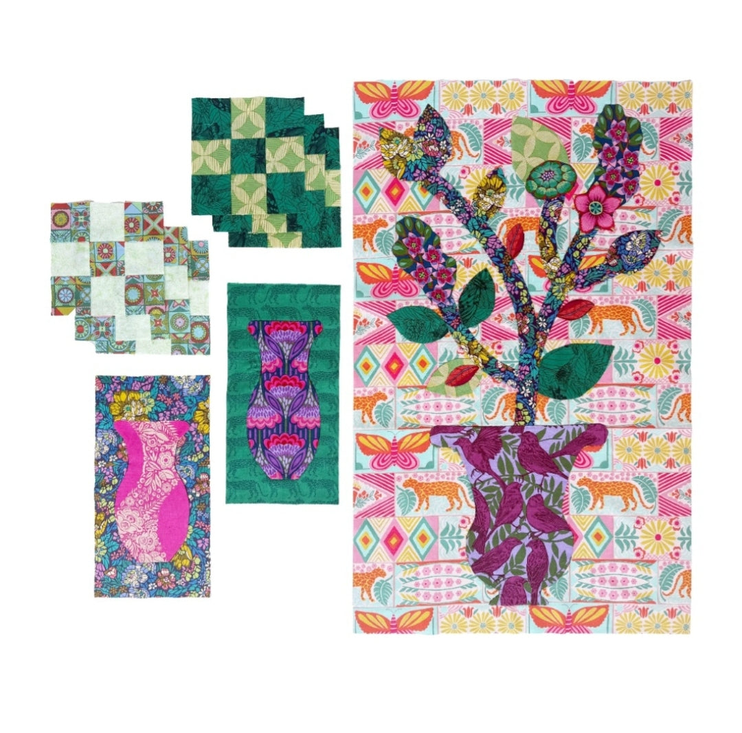 A set of colorful quilted fabric pieces displayed on a white background, featuring a large rectangular quilt with a floral cactus design and several smaller square and rectangular quilts with geometric and abstract patterns.