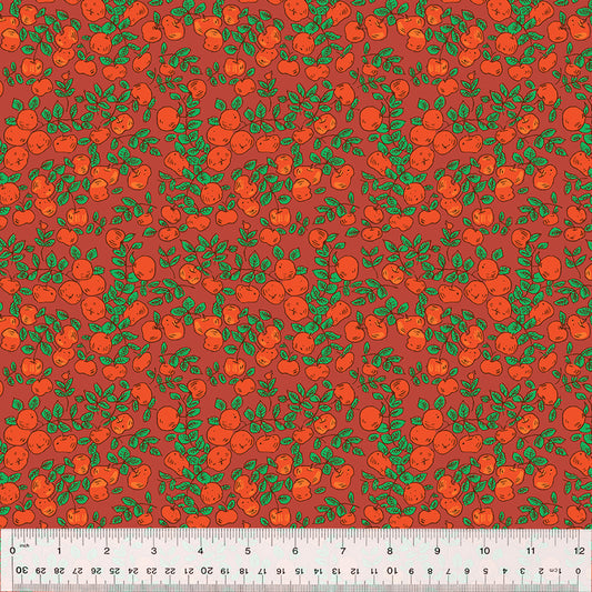 an apple print on burgundy fabric
