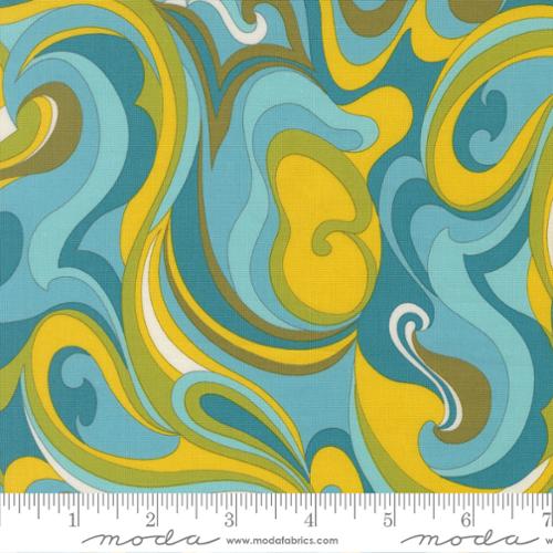 Green, blue, white and yellow swirled in an abstract pattern with a Moda ruler at the bottom