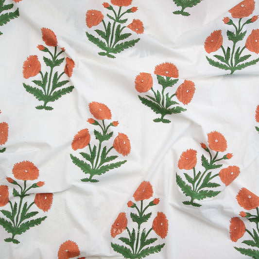 White fabric with orange and green floral patterns