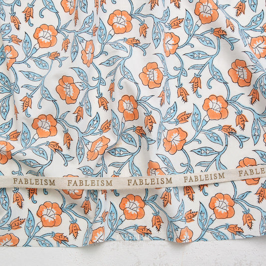 Floral patterned fabric with 'Fableism' branding on a white background