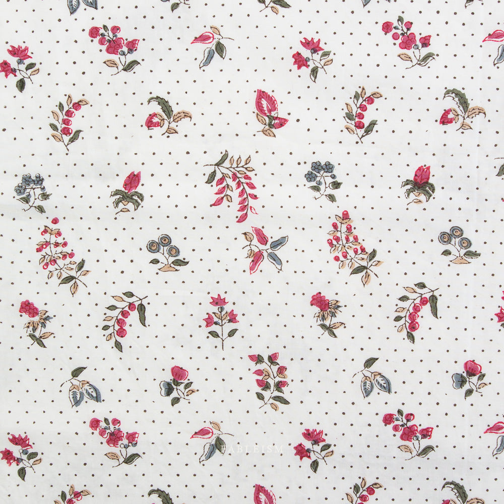 Floral pattern with red flowers and green leaves on a white background with black dots