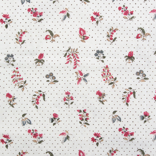 Floral pattern with red flowers and green leaves on a white background with black dots