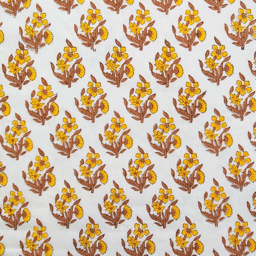 Pattern of yellow flowers with brown stems on a white background