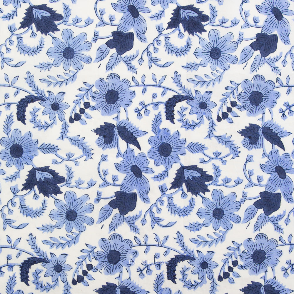 Pattern of blue flowers and leaves on a white background