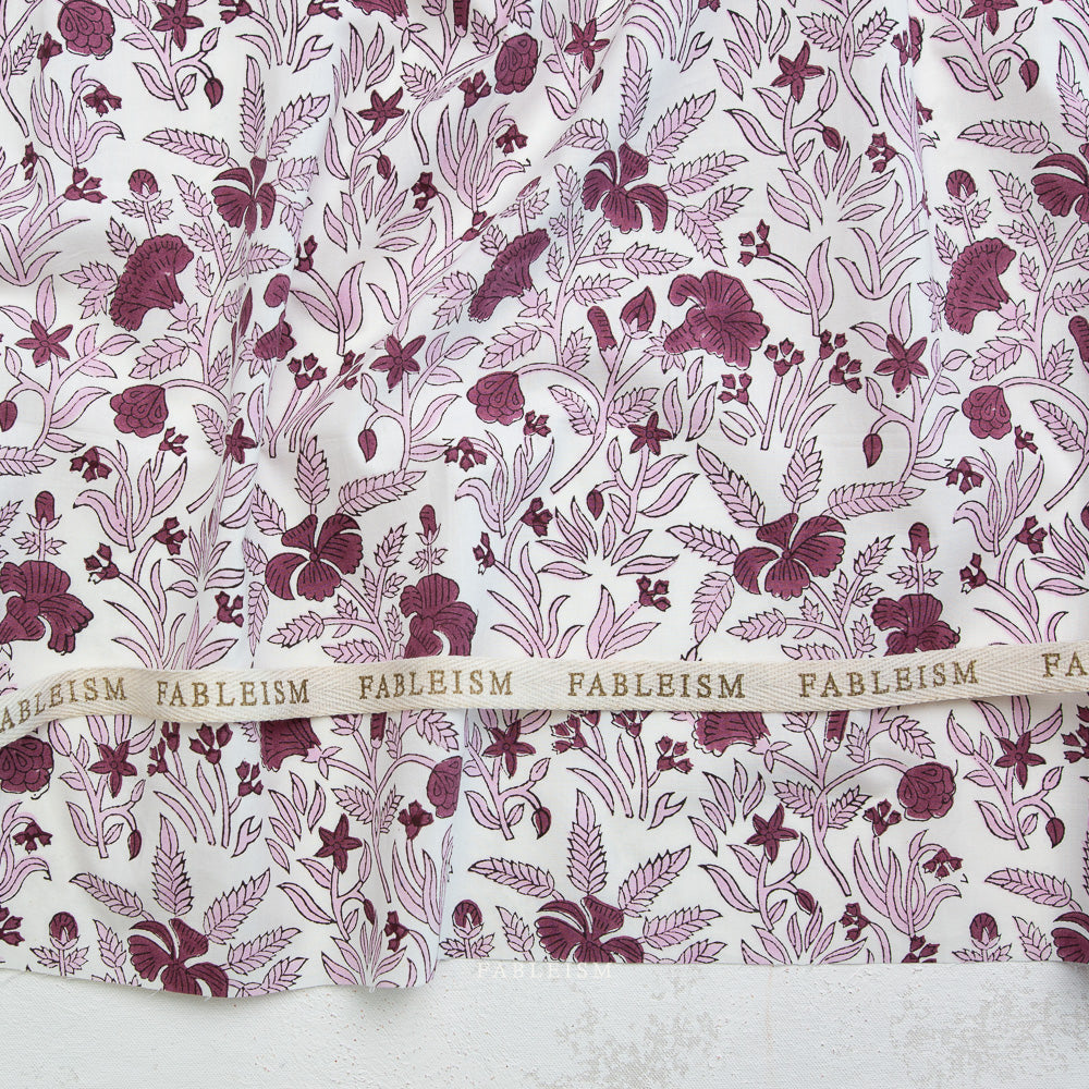 Fabric with a floral pattern and 'Fableism' branding.