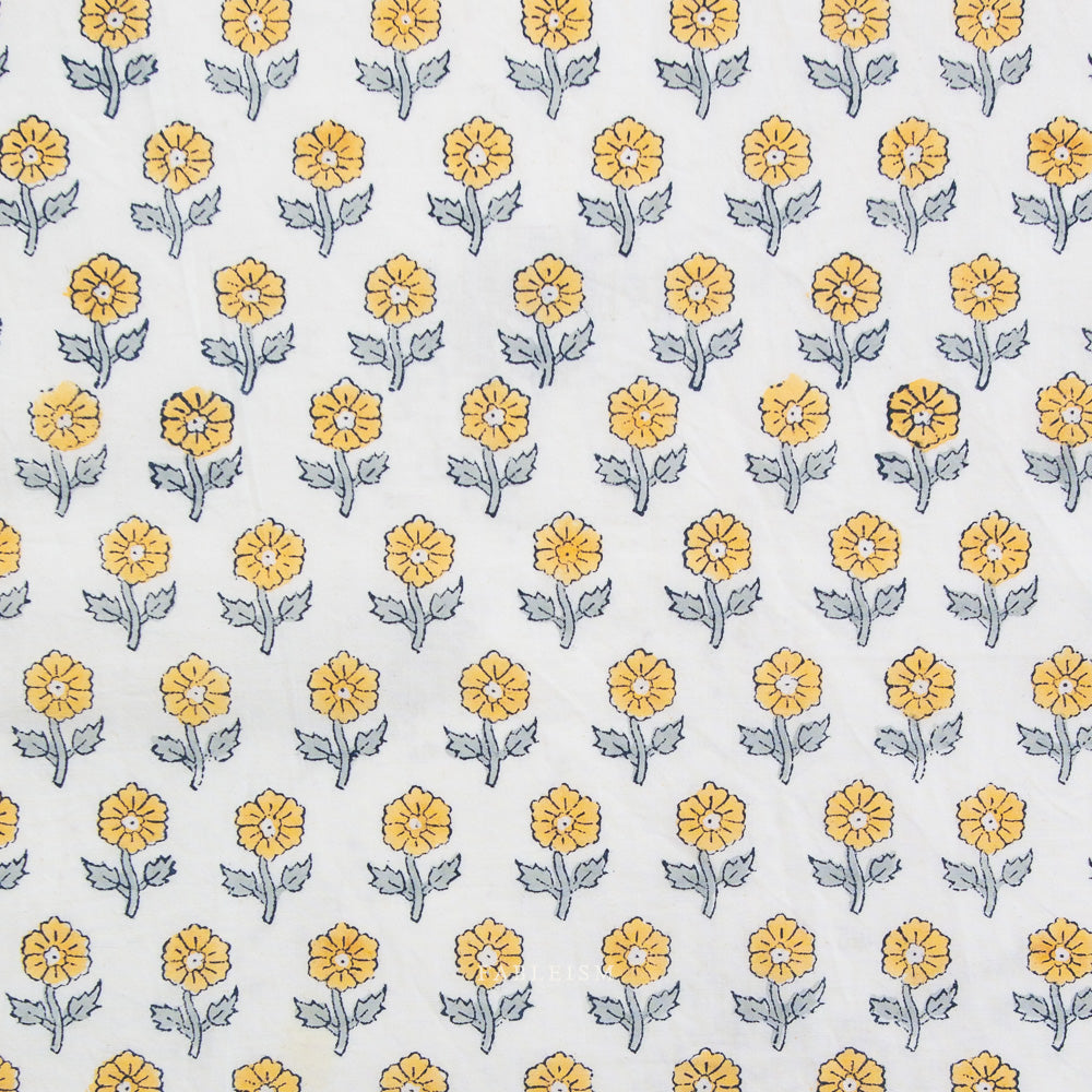 Pattern of yellow flowers with green stems on a white background
