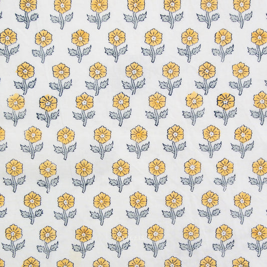 Pattern of yellow flowers with green stems on a white background