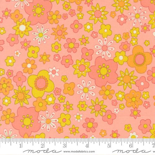 Pink, yellow, and orange flowers on a pink background with moda ruler at the bottom