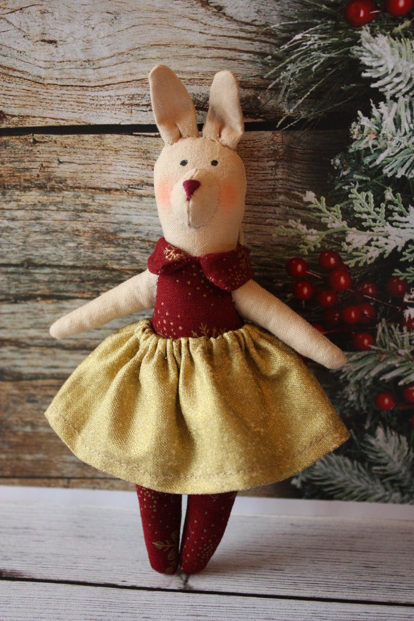 fabric doll with gold skirt