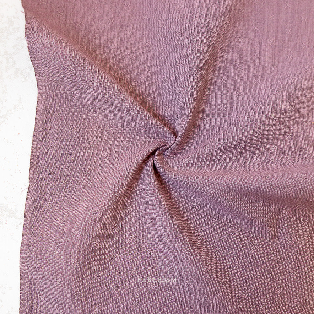 Lavender fabric with embroidered X detail