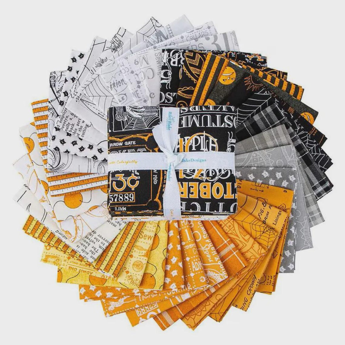A bundle of fabric cut sheets tied with a white ribbon, arranged in a circular stack on a light gray background. The fabrics feature various Halloween-themed patterns including spiderwebs, jack-o'-lanterns, ghosts, and spooky typography in orange, yellow, black, white, and gray.