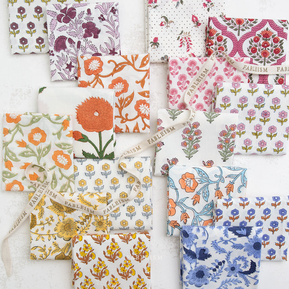 Collection of floral patterned fabric swatches on a white background