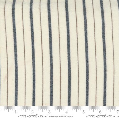 Fabric with blue vertical stripes and brown thin stripes on a white background, featuring Moda label.