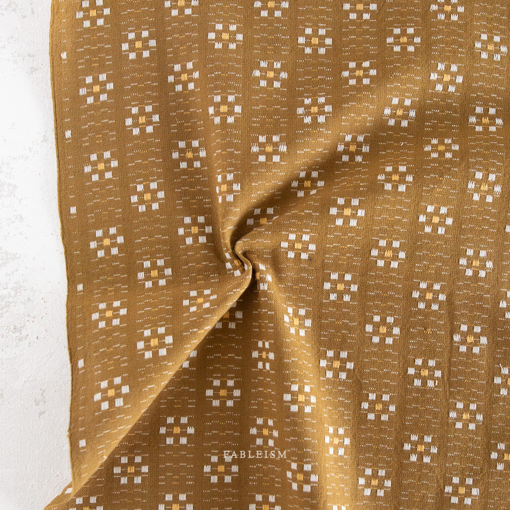 woven flowers in cream and yellow on olive